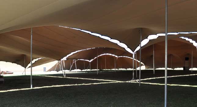 Different sized chino-coloured stretch tents linked together: interior